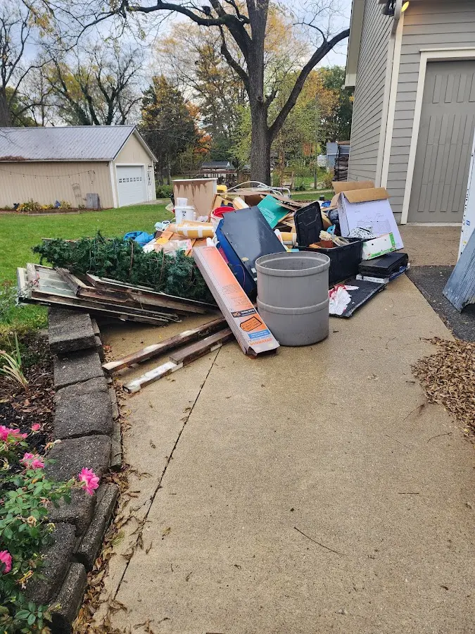 Dumpster being loaded with debris for 3 Yard Dumpster Rental in Pikesville